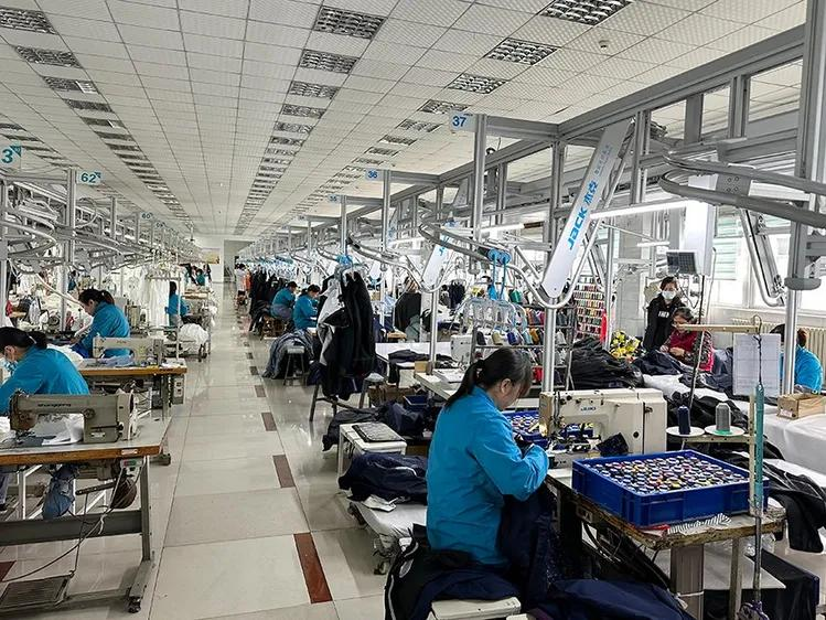 Garment factory production floor with sewing operators